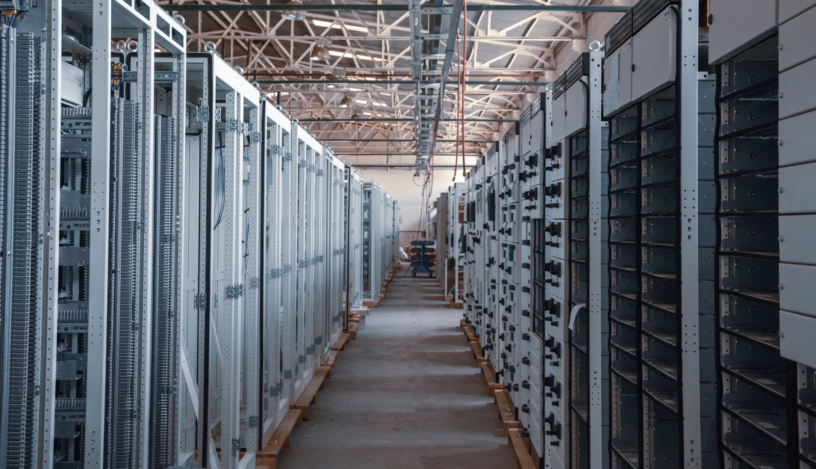 Datacenter hall with rows of server cabinets